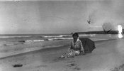 Original title:  Lucy Maud Montgomery on Cavendish shore, ca.1923. Cavendish, P.E.I. Courtesy of L. M. Montgomery Collection, Archival & Special Collections, University of Guelph.