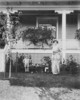 Titre original&nbsp;:  Nellie L. McClung, son fils Mark et son chien Philip dans la cour avant de sa maison au 11229 - 100e Avenue.  / Nellie L. McClung, her son Mark and dog Philip in the front yard of her house at 11229 - 100 Avenue