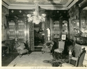 Original title:  Image from Hamilton Public Library, Local History and Archives. 
Wesanford, the library, after 1917.  On the wall is a painting of Mrs Sanford by British artist Henry Harris Brown, present location unknown. The woodwork in this room, unchanged from the 1877 remodelling, is by the Hoodless Company of Hamilton.

Opposite the drawing room the library, with a deep blue wall of silken tapestry, affording relief to the dark walnut of the dado and the light russet of the ceiling’s centre, which is charmingly shaded back to the blue of the walls. The mahogany floor is very rich. Toronto Empire, June 13, 1892.