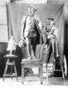 Original title:  R. Tait (Robert Tait) McKenzie at work in his studio on his sculpture of young Benjamin Franklin, 1911