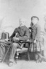 Original title:  Print of photograph of Sir Robert John Pinsent (judge) seated with his young daughter (?). Memorial University of Newfoundland, Maritime History Archive Public Photo Catalogue. 