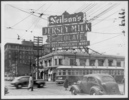 Original title:  City of Toronto Archives - Series 1230, Item 6818. 
Neilson’s Jersey Milk neon billboard sign, north-west corner Bay Street and Bloor Street West ca. 1945. 