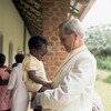 Original title:  Cardinal Léger holding a child named Lisa at the Centre for Handicapped Children in Yaoundé. 