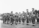 Original title:  General H.D.G. Crerar, General Officer Commanding 1st Canadian Army, and Captain C.B. Newman, Assistant Provost Marshal, 4th Canadian Armoured Division, inspecting a company of the Canadian Provost Corps, Apeldoorn, Netherlands, 12 July 1945. 