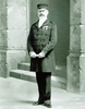 Original title:  Governor Charles-Amédée Vallée, former administrator of the Old Montreal jail. He is standing outside the Maison du Gouverneur.