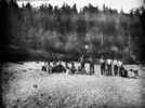 Original title:  [Haida Indians of Ya-Tza Village, Graham Island, Queen Charlotte Islands, B.C. Chief Edenshaw standing second from left.]. 